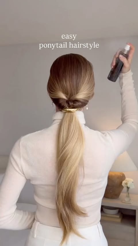 Instagram post by @alexgaboury for Luxy Hair. Caption reads: An easy ponytail hairstyle✨
finished with a....
