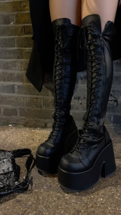 Instagram post by @erinrubyliu for Demonia Shoes. Caption reads: [...] nooo look at my dropped wallet....