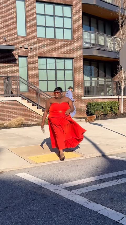 Instagram post by @keziakswift for ELOQUII. Caption reads: Excuse Me. STRAPLESS PLEATED MIDI DRESS @eloquii....