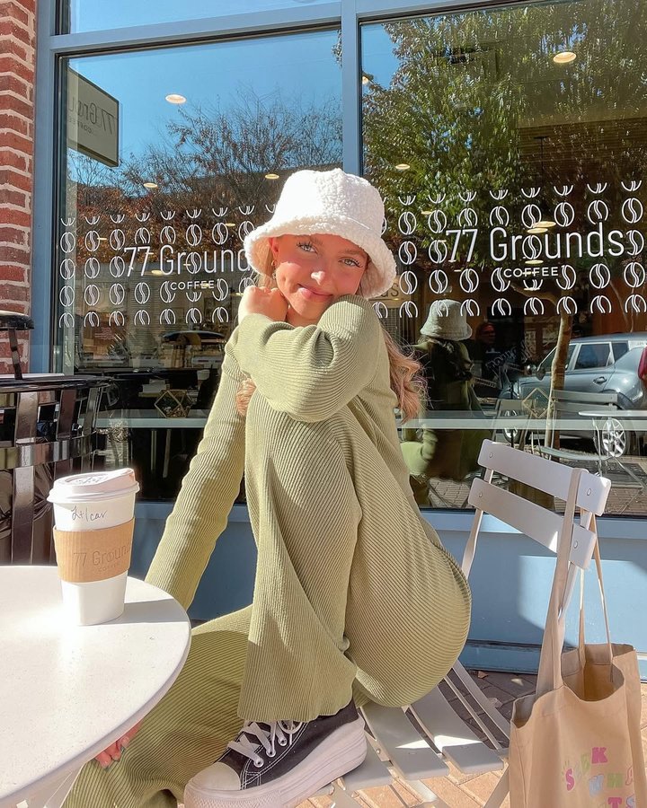 Instagram post by @jennibrhodes for GOLD HINGE. Caption reads: [...] day ☀️🍂☕️📚 wearing comfies from @goldhinge....