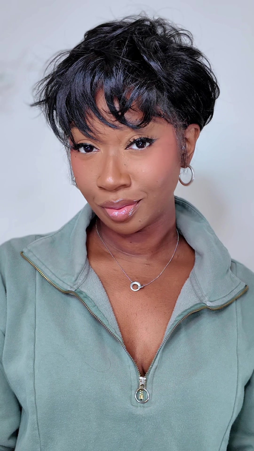 TikTok post by @tanwilliams_xo for Outre. Caption reads: [...] so short hair is a MUST! Hair from @outre....