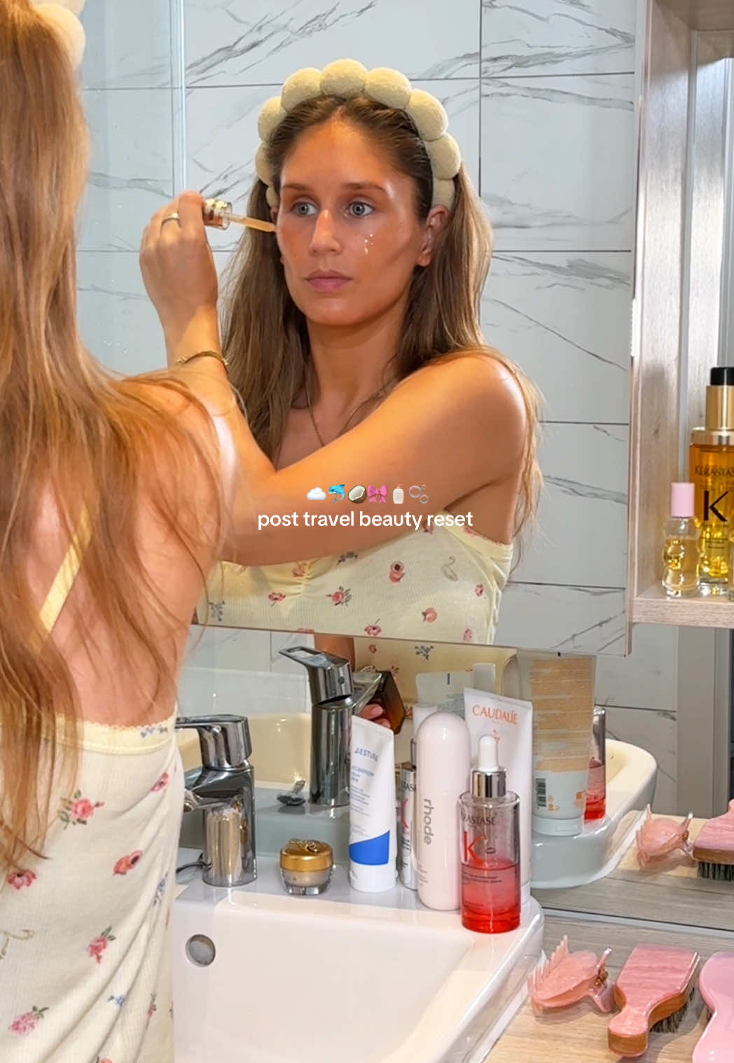 TikTok post by @by.emmaleah for Fenty. Caption reads: [...] showers >> ☁️🐬🥥🎀🧴🫧 products @Fenty Hair....
