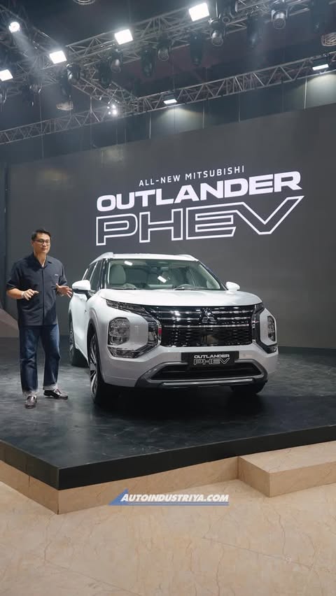 Instagram post by @autoindustriya for Mitsubishi Motors. Caption reads: Mitsubishi Motors just unveiled the Outlander PHEV....