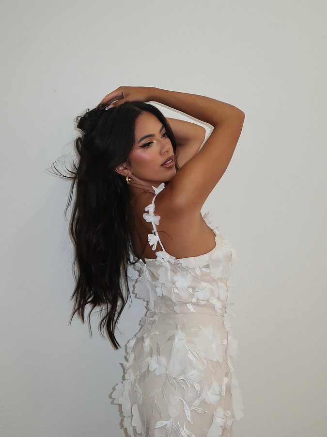 Instagram post by @adelainemorin for ELLIATT. Caption reads: Dreaming ☁️🤍💍 Dress is from @lulus x @elliatt....