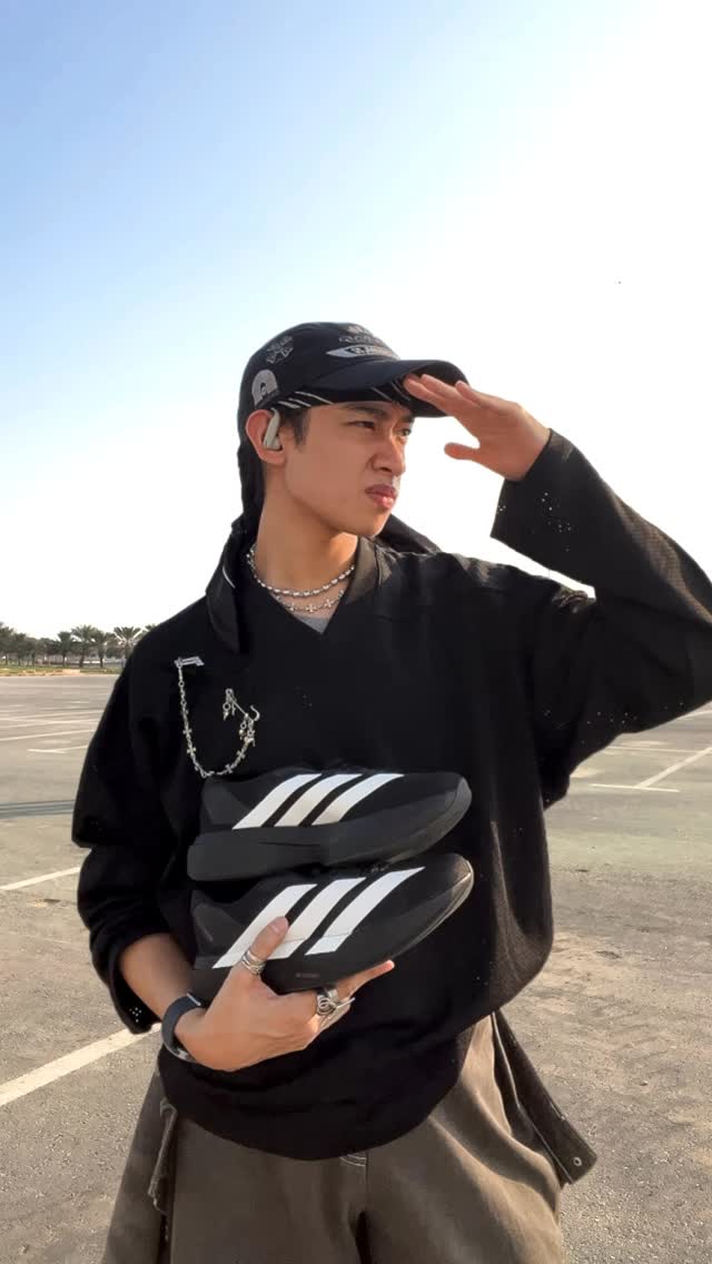 Instagram post by @loutabara for Namshi. Caption reads: Walk thru UAE 🇦🇪 in the adidas Evo SL, just 224g....