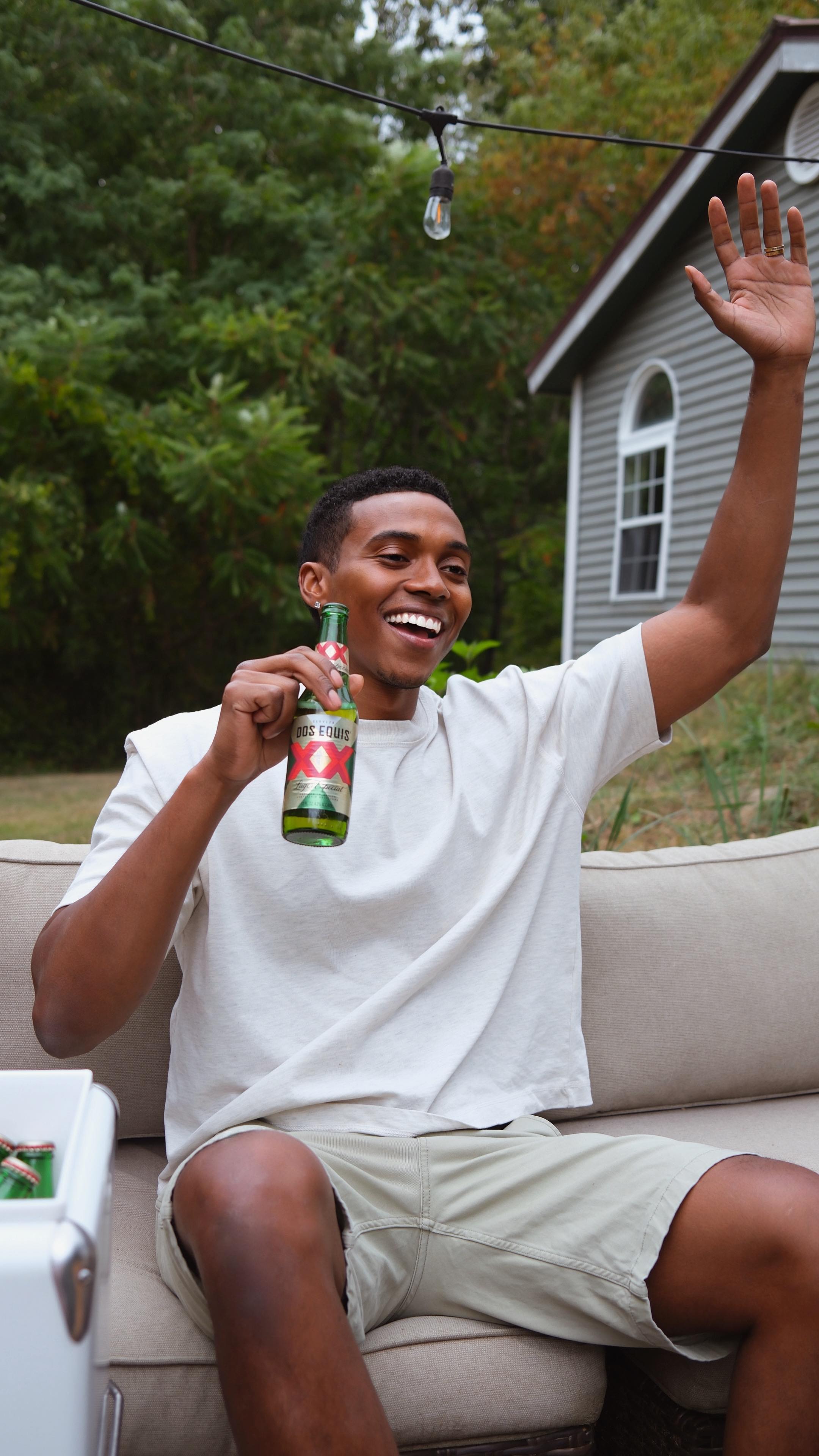 Instagram post by @luda_ for Dos Equis. Caption reads: #ad #ADMSG21+ Backyard game day vibes locked in....