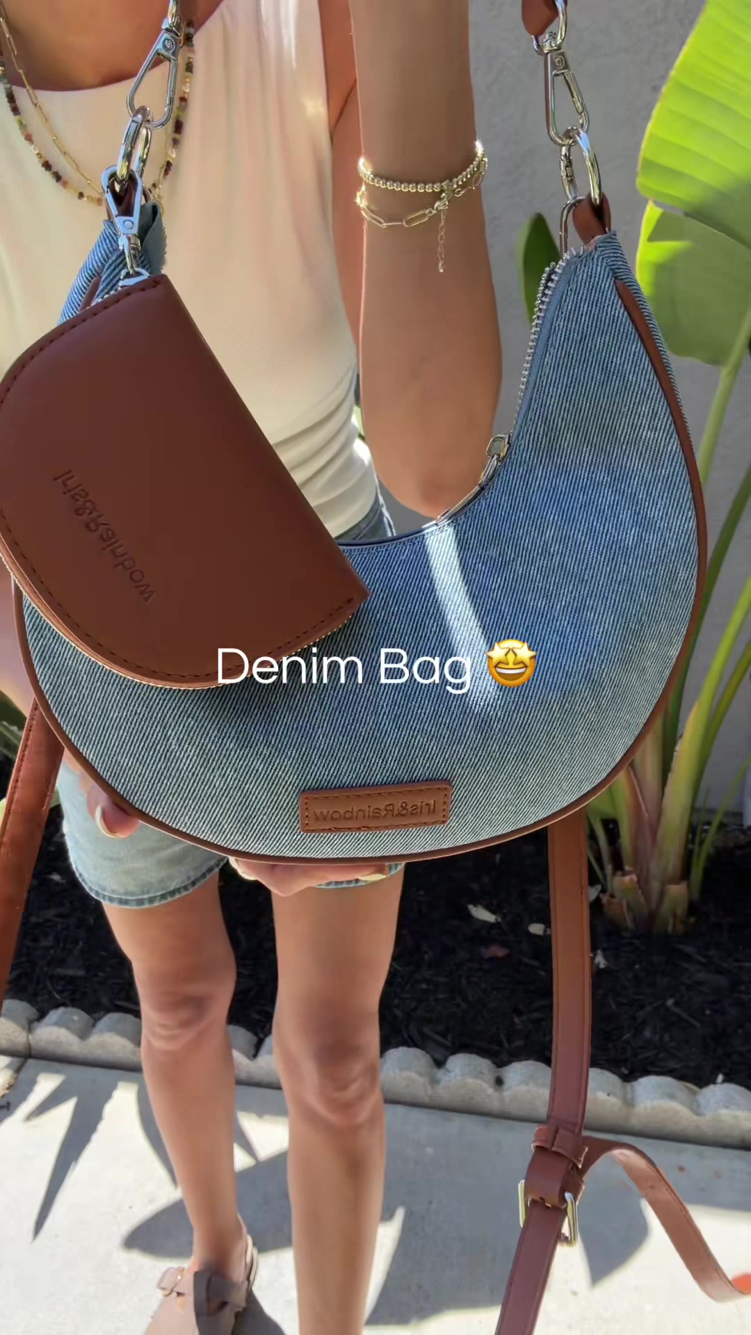 TikTok post by @chrissyashley.tt for Iris And Rainbow. Caption reads: She’s a stunner 🌈 @Rainbow Boutique LLC #denimbag....