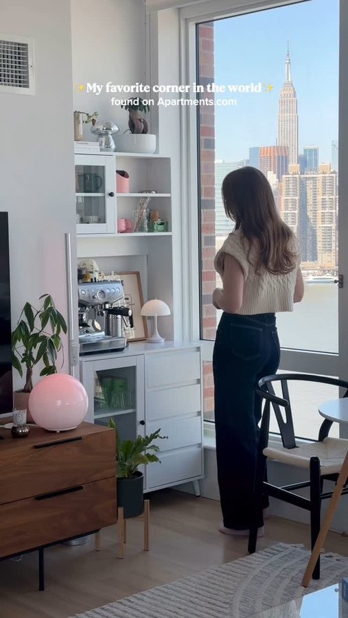 Instagram post by @itgirlhope for Spirit Airlines. Caption reads: #ad I love how my NYC apartment makes the most of....