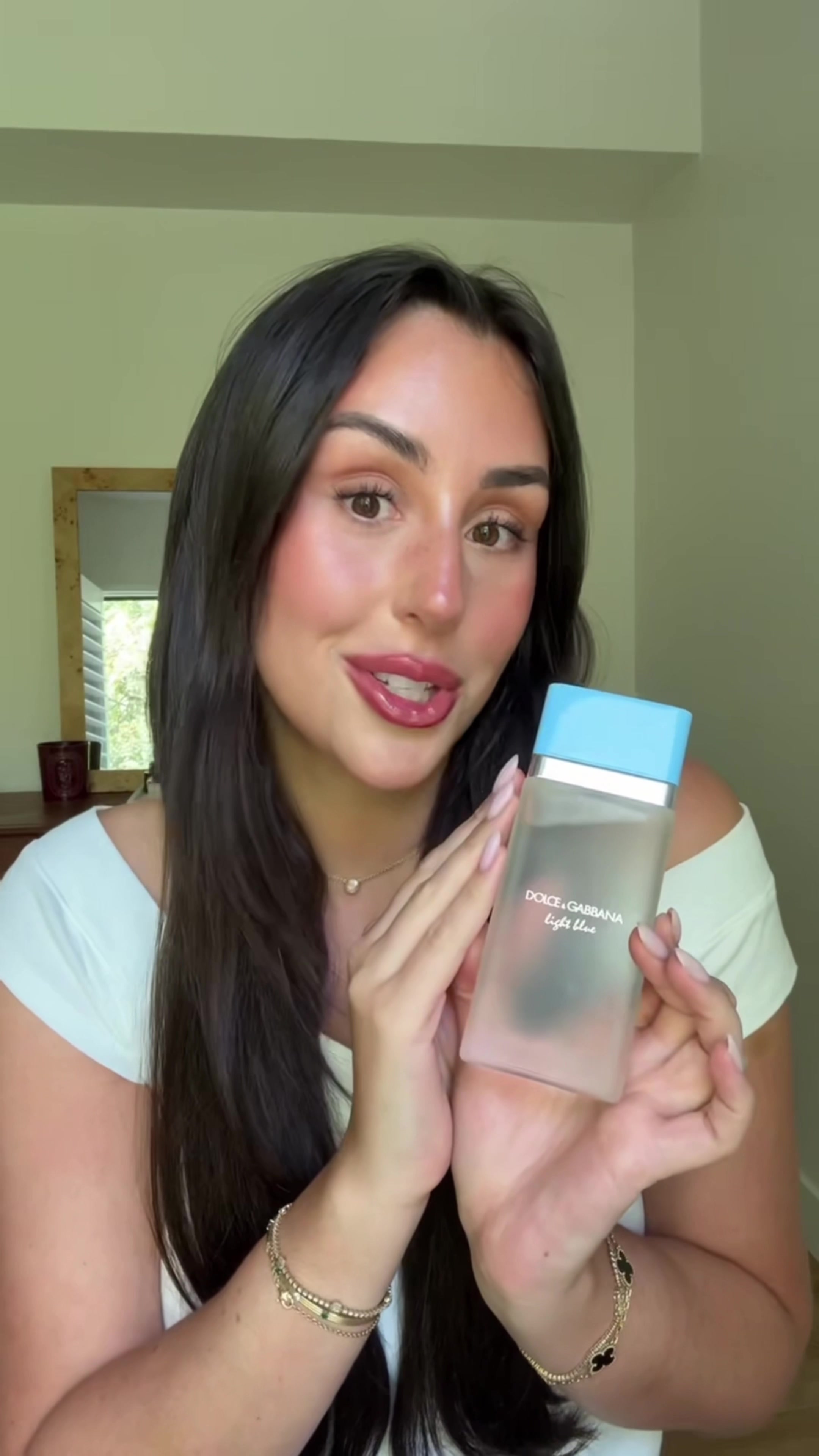 TikTok post by @carolinemstern for Dolce&Gabbana. Caption reads: @Dolce & Gabbana Light Blue is my summer signature....