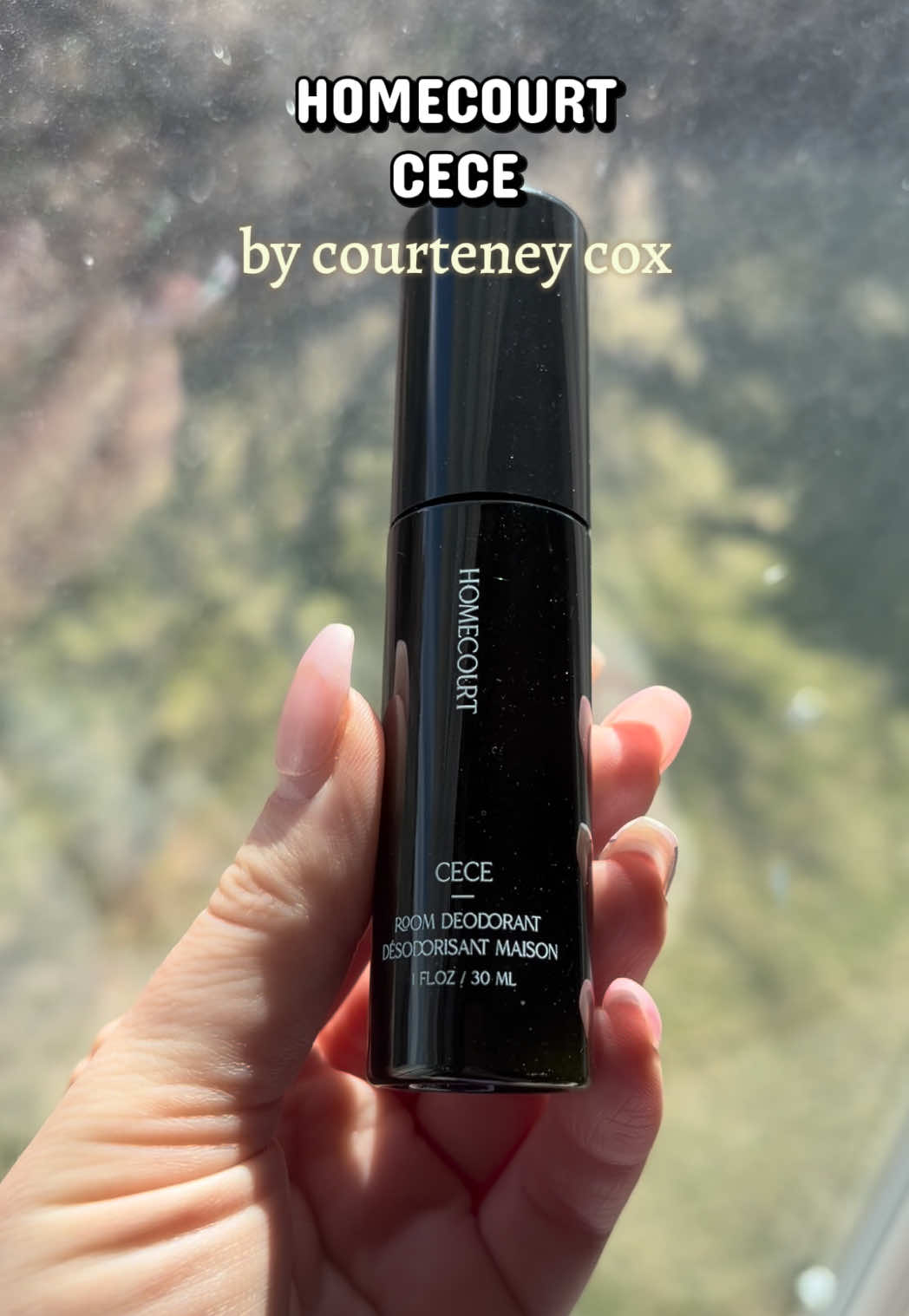 TikTok post by @michelle_putnam for Homecourt. Caption reads: Love this mini room spray from @Homecourt just 1-2....