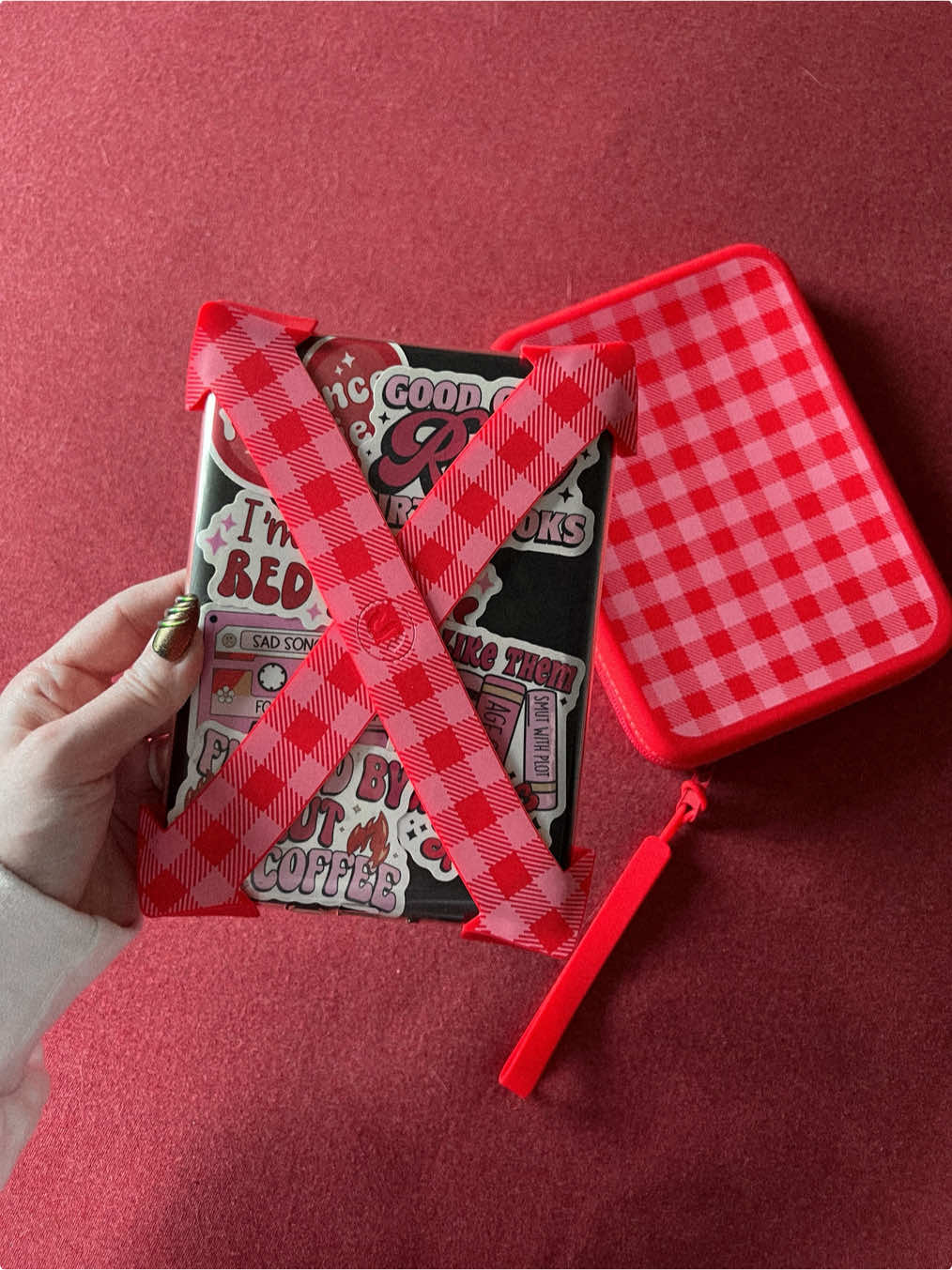 TikTok post by @buriedwithinpages for Strapsicle. Caption reads: [...] new favorite Kindle accessory is these....