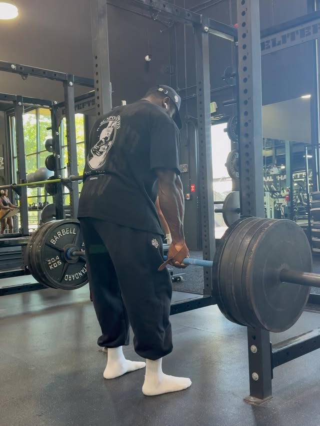 Instagram post by @dan_ifbbpro for Darc Sport. Caption reads: [...] shit but we still here 🙏🏿 back day....