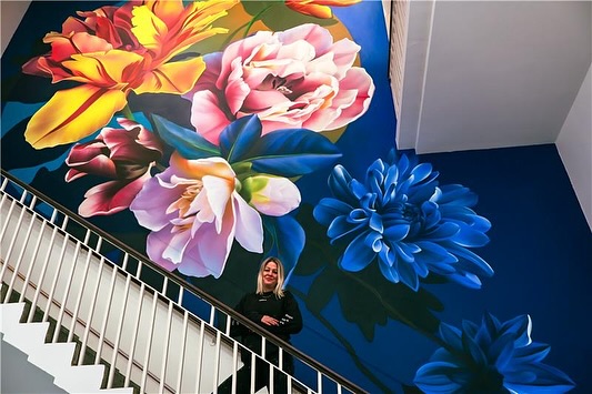 Instagram post by @sophiemess_ for Saatchi Gallery. Caption reads: 👀 Peep Peep: Sophie Mess’ amazing mural ‘Journey....