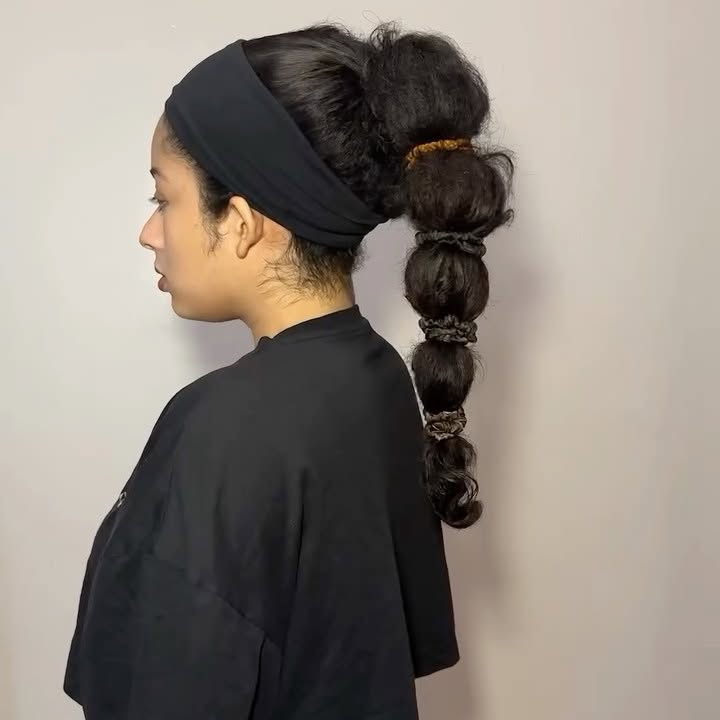 Instagram post by @curlswithalexa for Maui Moisture. Caption reads: Doing a ponytail before the gym because my hair is....