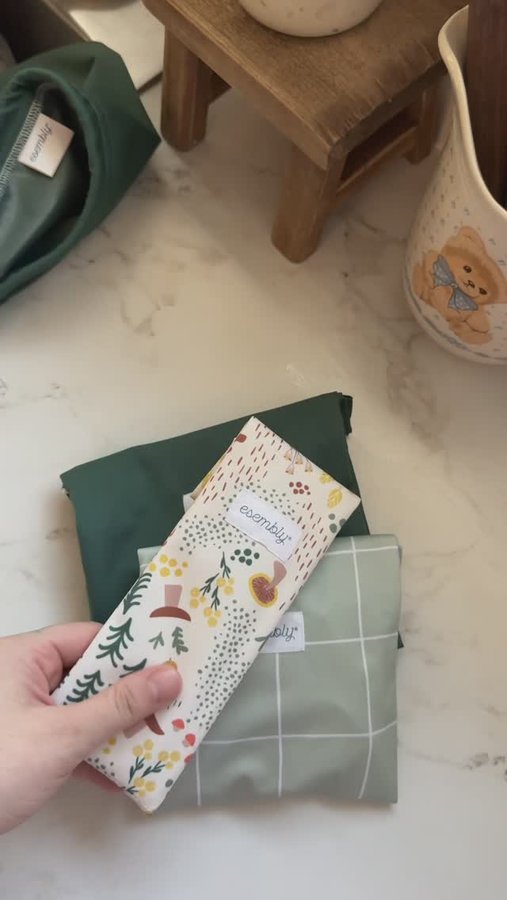 Instagram post by @nicolethemom_ for Esembly Baby. Caption reads: Pack a sustainable snack with us for indoor open....