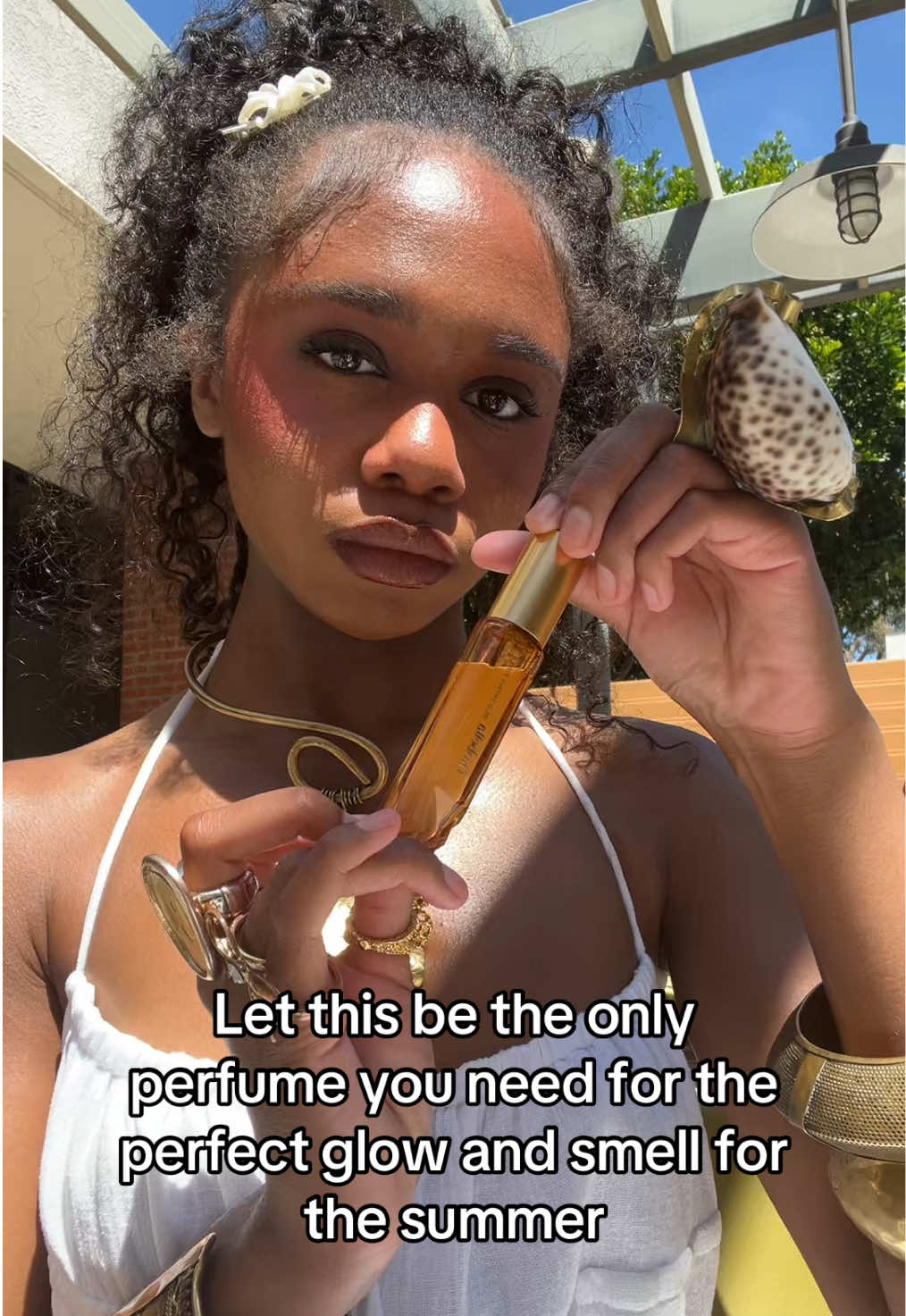TikTok post by @afrogirlygal for Orebella. Caption reads: @'Ôrəbella This is truly golden hour in a bottle.....