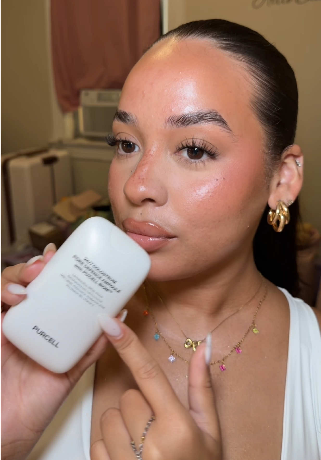 TikTok post by @dannayradiiaz for Purcell. Caption reads: [...] glass-skin glow without feeling greasy.....