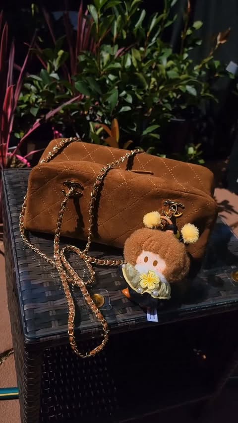 Instagram post by @mikaalychee for MINISO USA. Caption reads: [...] #FallHandbags #ChanelSuede #Myminisousa....