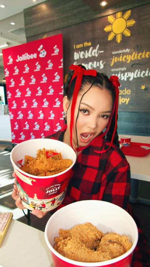 Instagram post by @bellapoarch for Jollibee US. Caption reads: Celebrate this Holiday with Jollibee! 
Link in my....