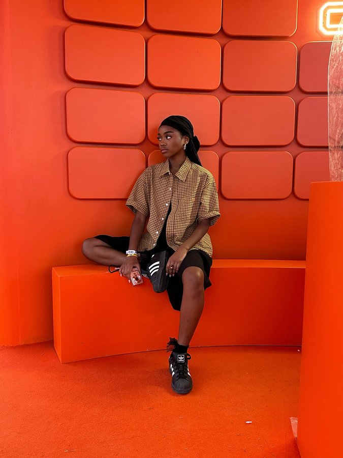 Instagram post by @kaaymbl for Courir. Caption reads: Festival day wearing my best Superstars @courir 🧡.