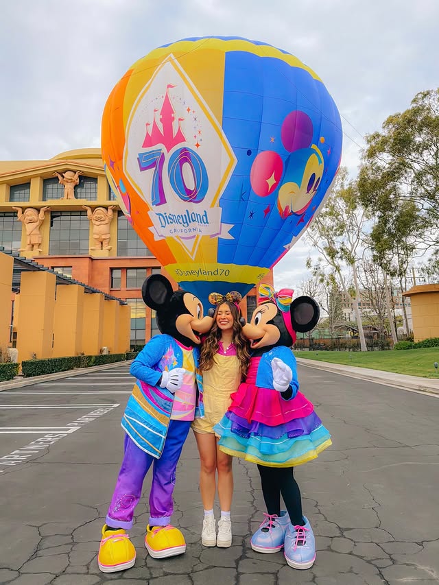 Instagram post by @emilynels8 for Disneyland. Caption reads: [...] & minnie, celebrating 70 years of....