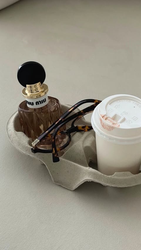 Instagram post by @giwta_iwannidou for Miu Miu. Caption reads: #ad Getting ready with my @miumiu glow , and yes,....