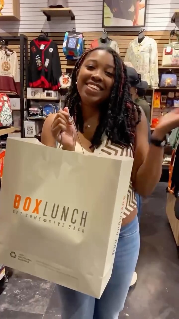 Instagram post by @ryanna.vision for Boxlunch. Caption reads: Wait a minute! 👀 BOGO 50% off the entire store!....