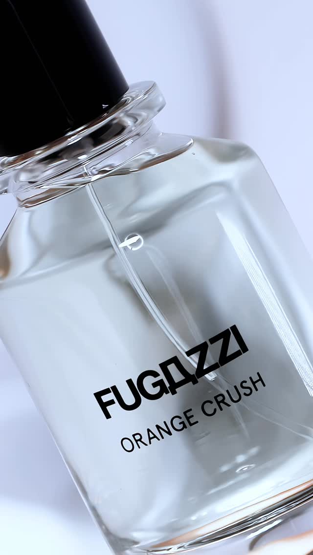 Instagram post by @makeupglamlu for FUGAZZI Fragrances. Caption reads: [...] Orange Crush Extrait de Parfum by....