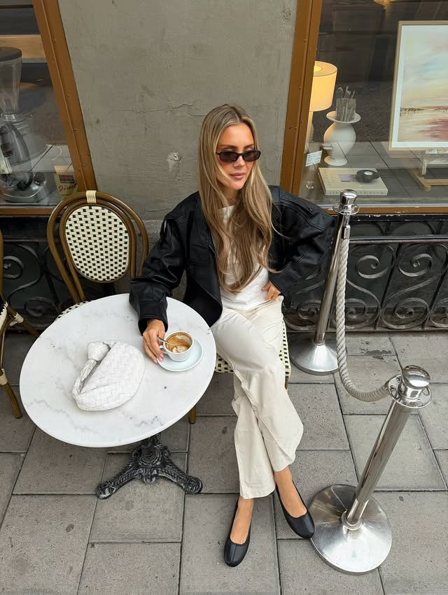 Instagram post by @emmygunn for NELLY.COM. Caption reads: Ad @nellycom CHIC CITY SUMMER with NELLY 🤍☕️ all....