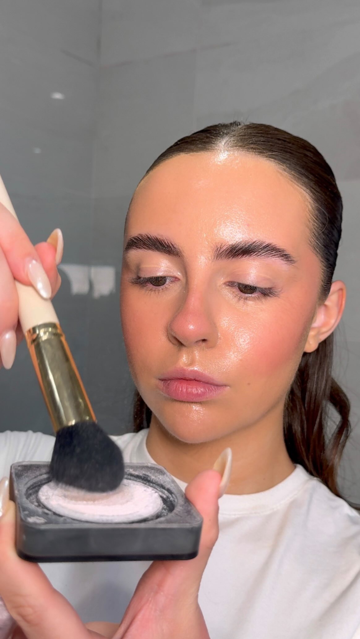 Instagram post by @livhudsonmakeup for Spectrum Collections. Caption reads: setting your undereyes with a brush is my new....