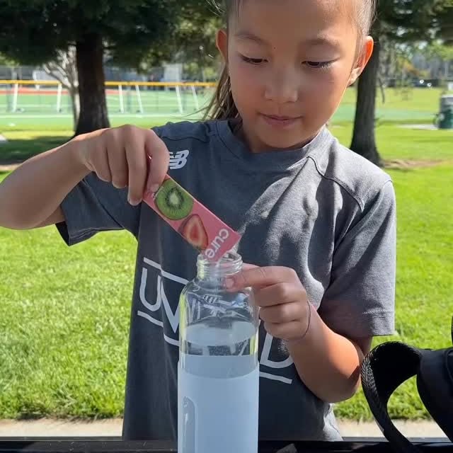 Instagram post by @kickitwiththekarlins for Cure Hydration. Caption reads: [...] by soccer practice. #sponsored #cure....
