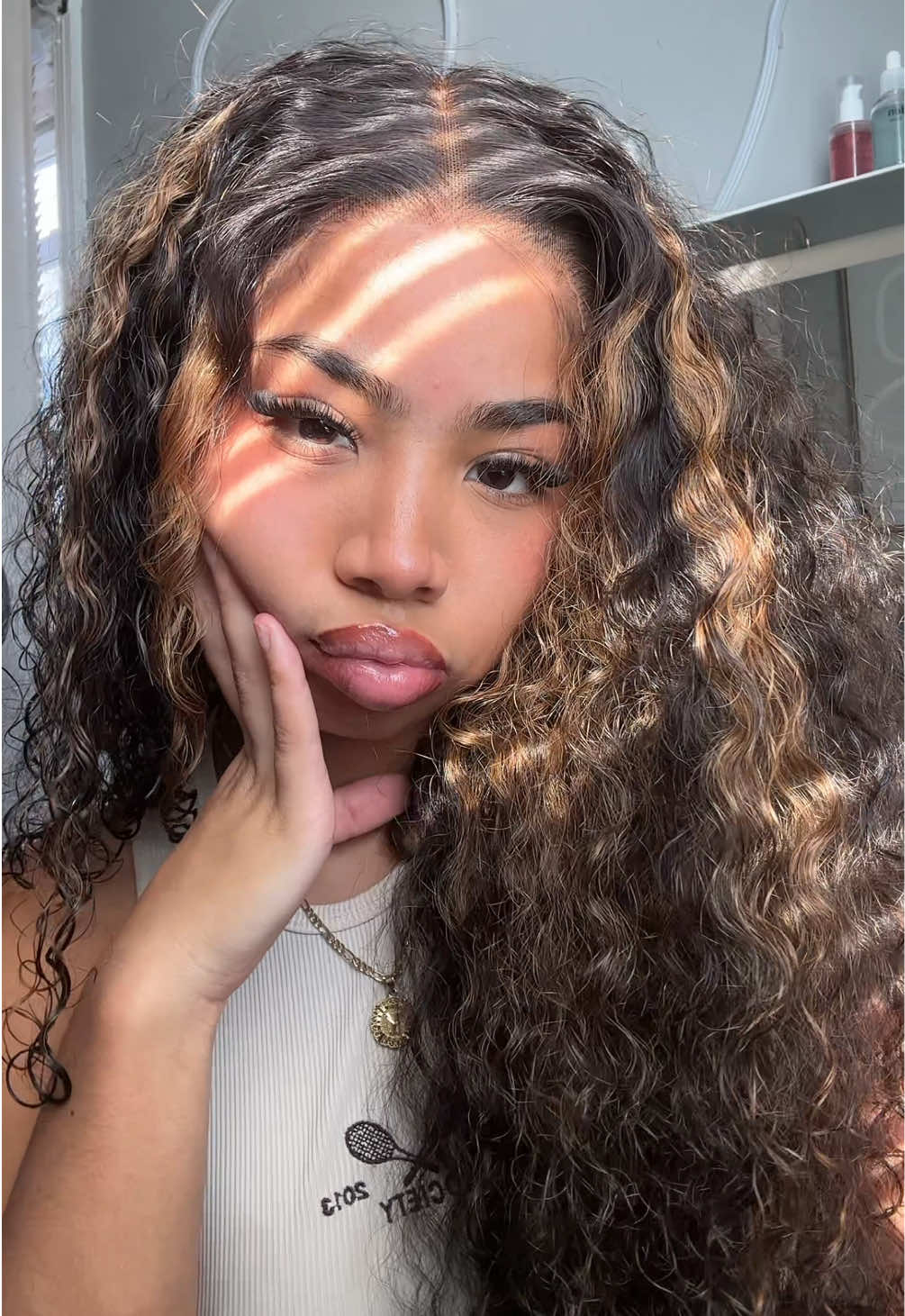 TikTok post by @theknown.seli for Amanda Hair. Caption reads: The highlight + Burmese curly yess @amandahair....