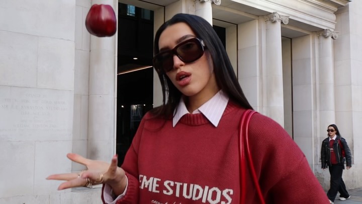 Instagram post by @evajan.x for EME STUDIOS. Caption reads: [...] sentence: an apple a day… 🍎 outfit....