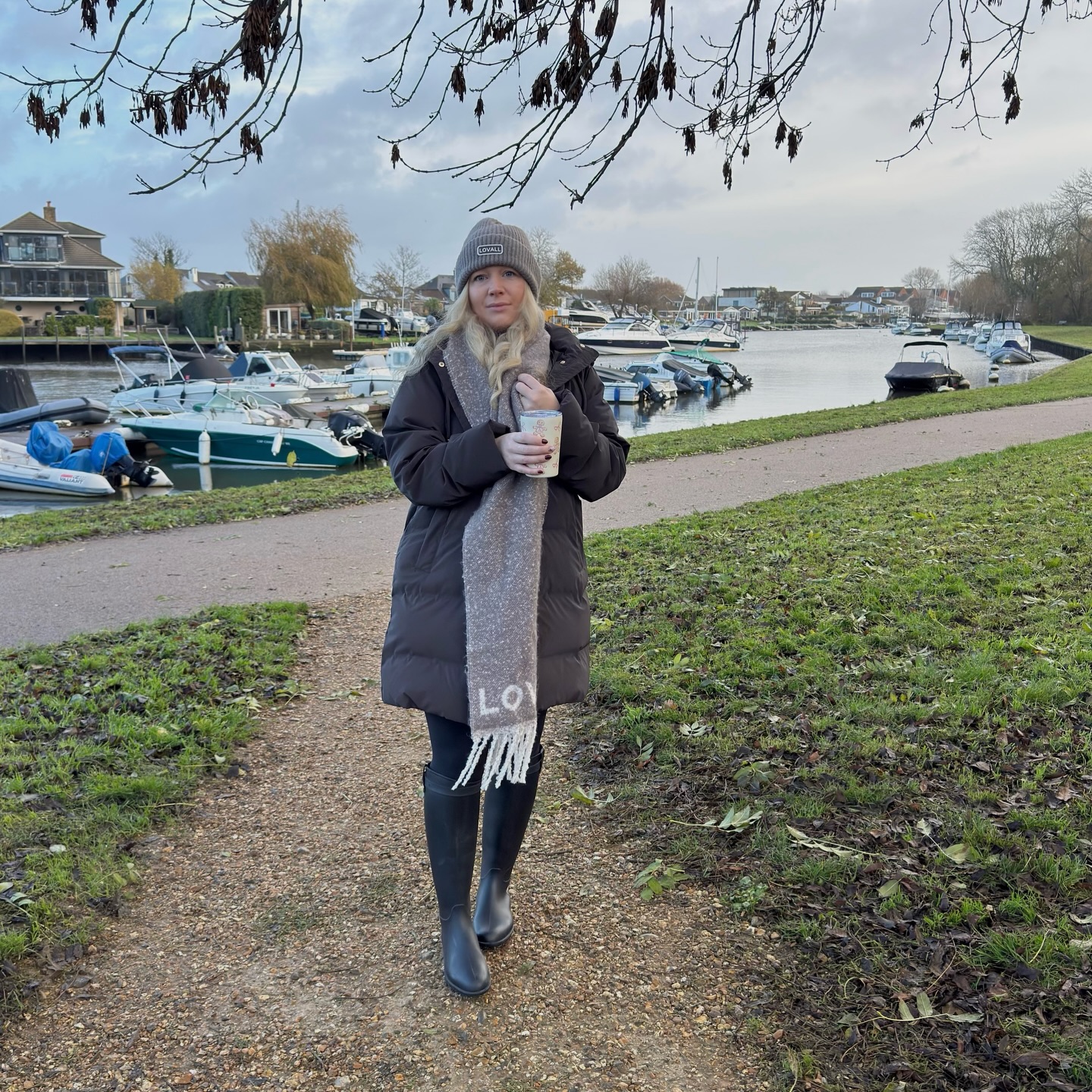 Instagram post by @mrskellyc_ for LOVALL. Caption reads: Living in @lovallofficial for the season 🫶🏻

Hat....