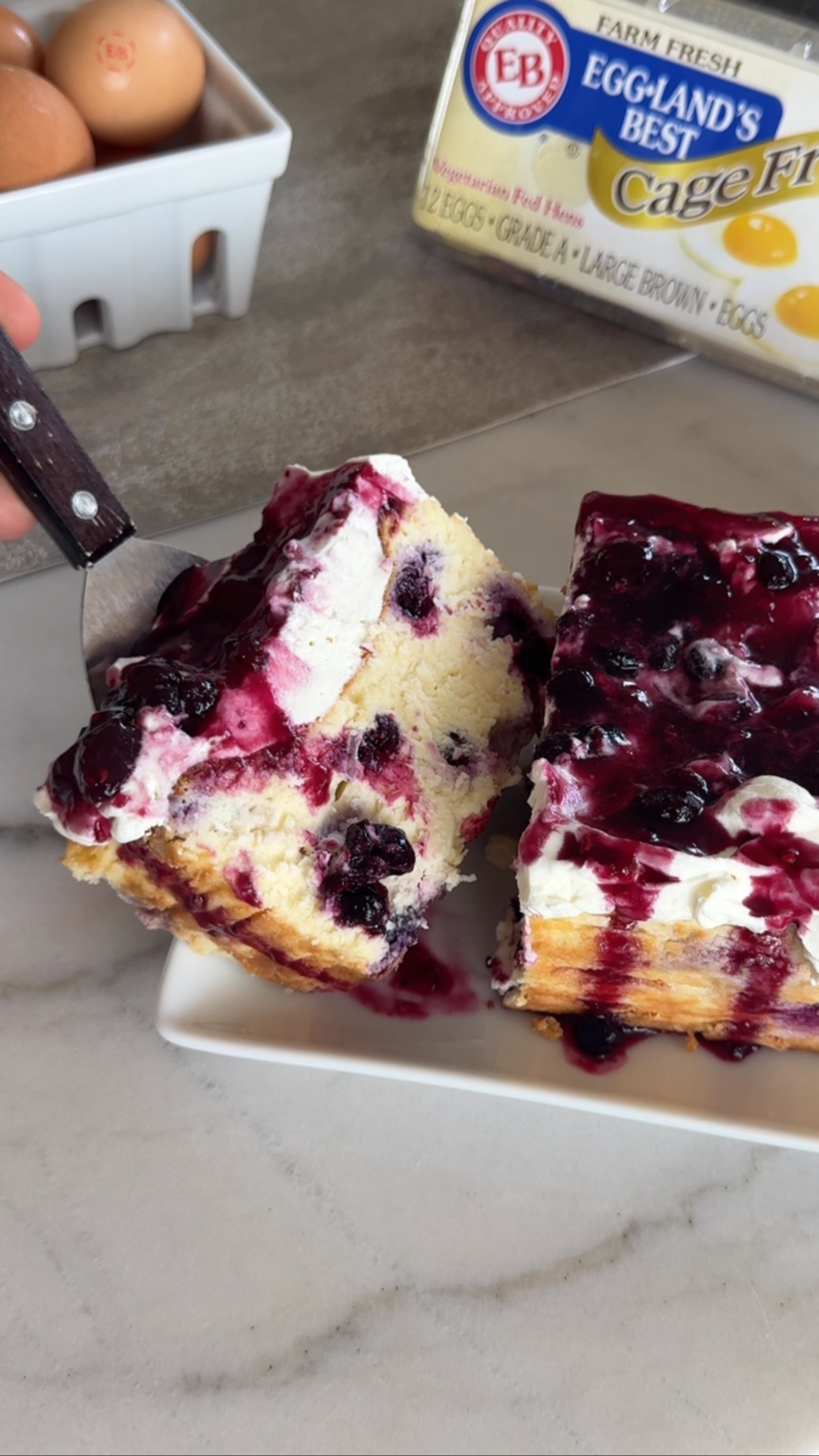 Instagram post by @dolcebakes_ for Eggland's Best. Caption reads: Lemon Blueberry Burnt Basque cheesecake with....