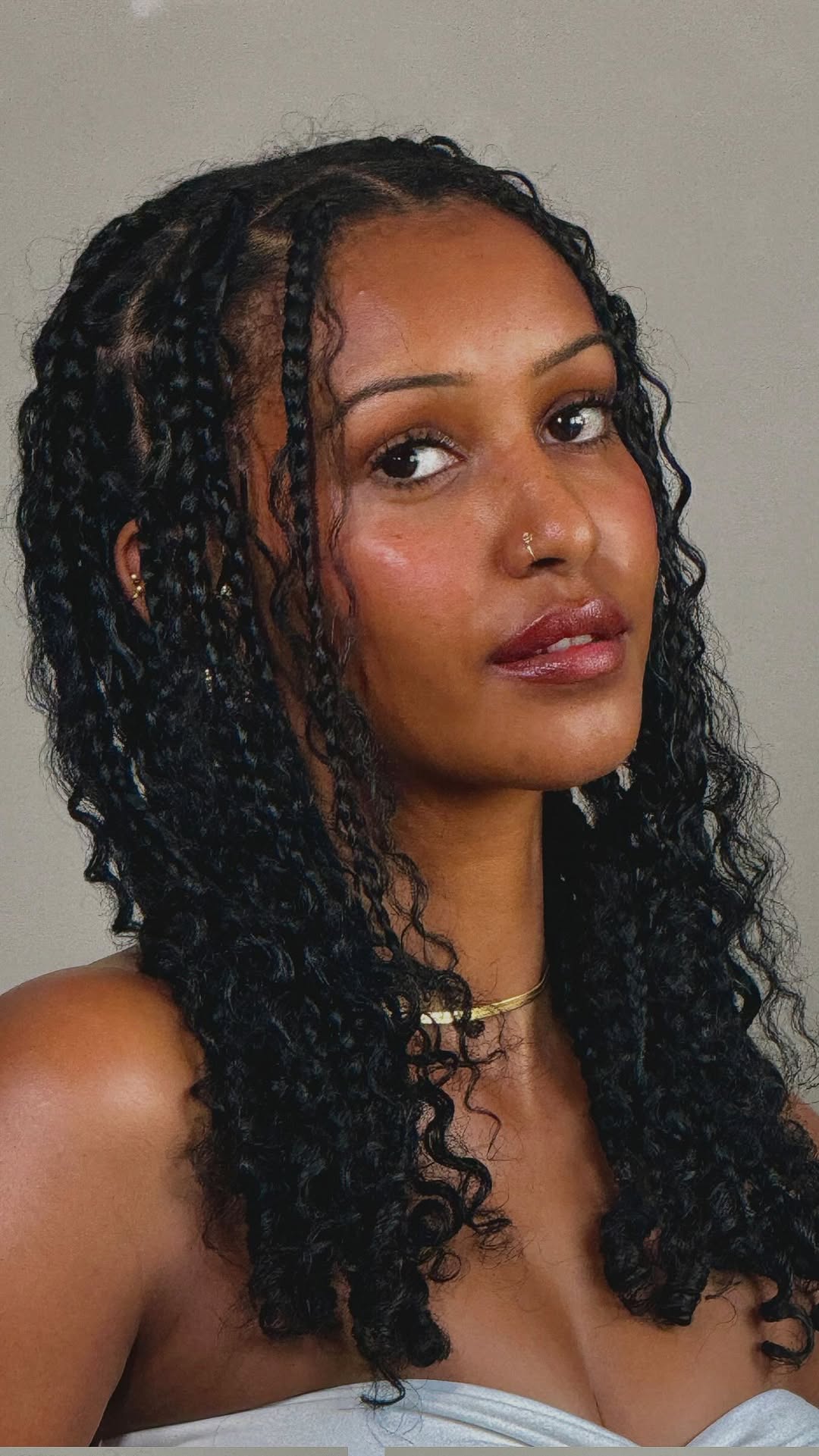 Instagram post by @elsadesiiree for Carol's Daughter. Caption reads: Natural knotless boho braids on my hair! I’ll be....