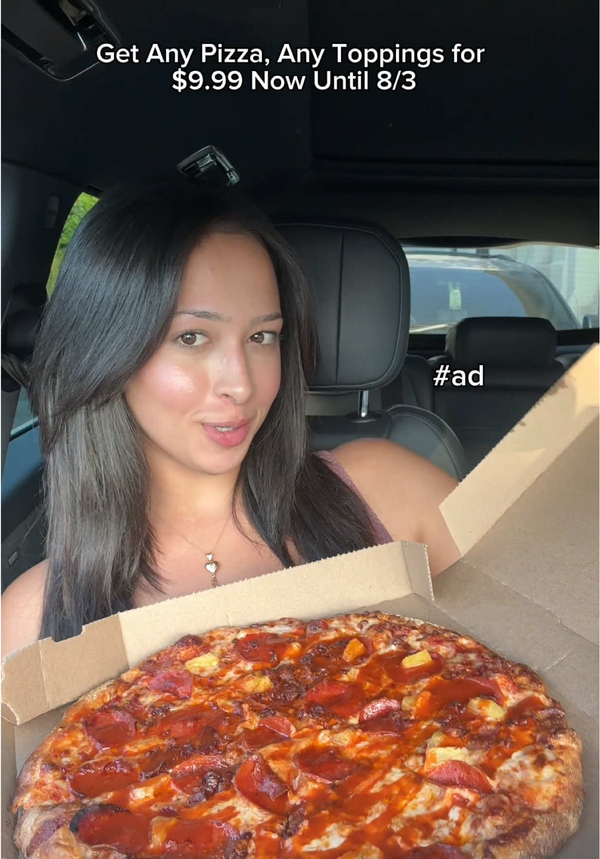 TikTok post by @sanaaeats for Domino's. Caption reads: #ad get any pizza, any toppings for $9.99 NOW-8/3!....