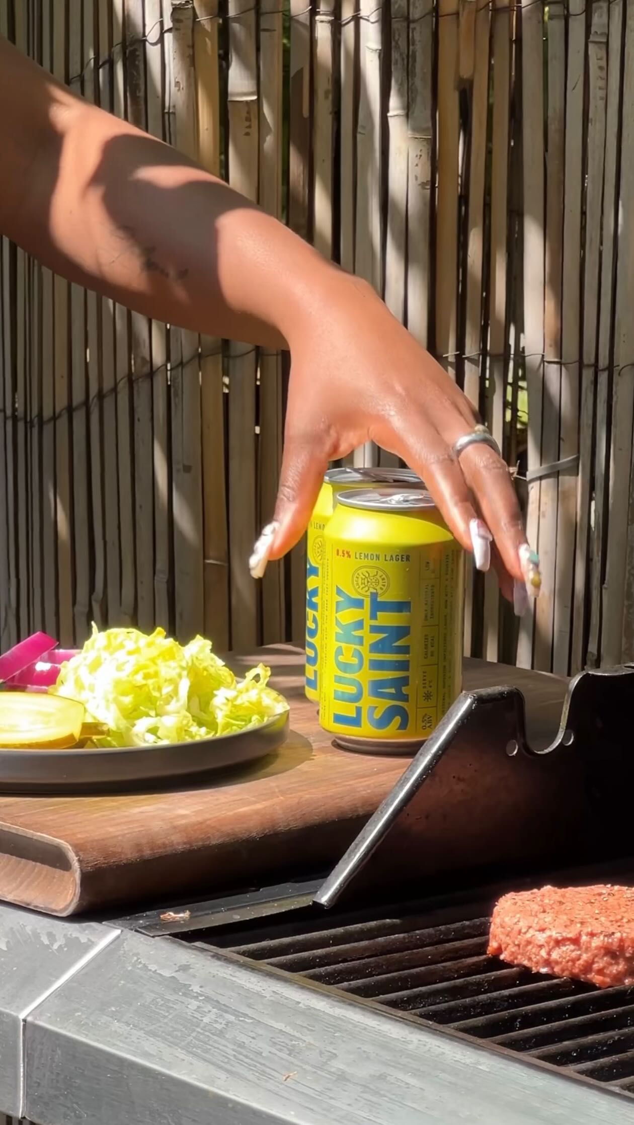 Instagram post by @eatwithebs for Lucky Saint. Caption reads: @luckysaintbeer coming through with this alcohol....