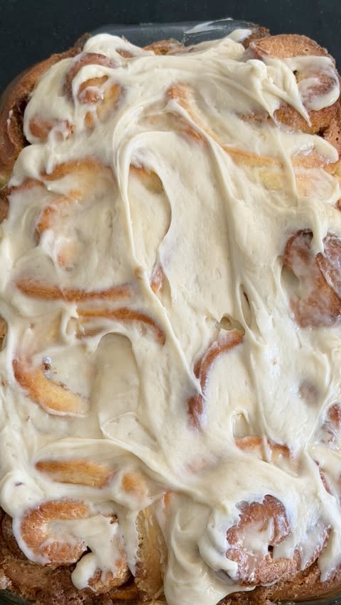 Instagram post by @crustbycarson for KerrygoldUSA. Caption reads: #ad #bakedwithgold MY WORLD FAMOUS CINNAMON ROLLS....