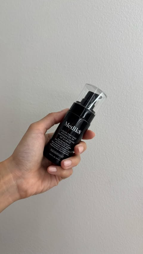 Instagram post by @l0vemarisa for Medik8. Caption reads: [...] to my skincare routine 🫧🖤 @officialmedik8....