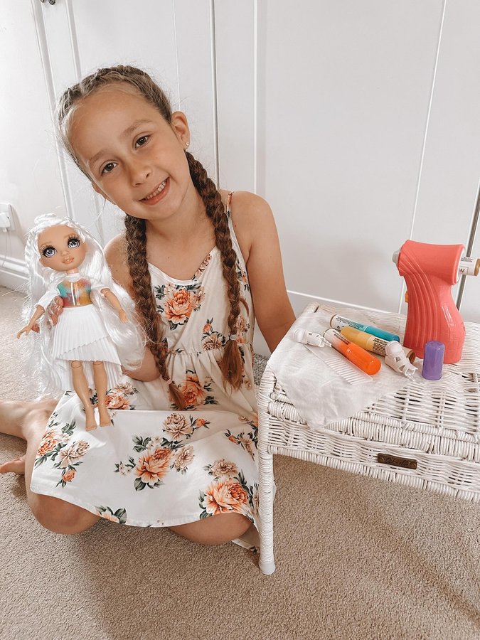 Instagram post by an influencer for Smyths Toys Superstores. Caption reads: Rainbow high! 🌈 Such a chilled Sunday, no regrets....