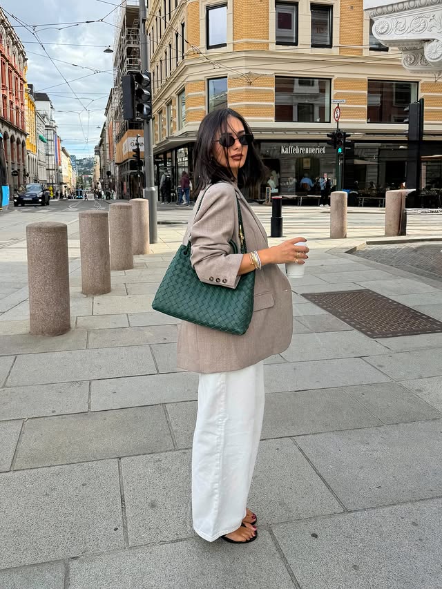 Instagram post by @annarasmiaa for NA-KD. Caption reads: Back in the city 🤎 @nakdfashion currently has 30%....