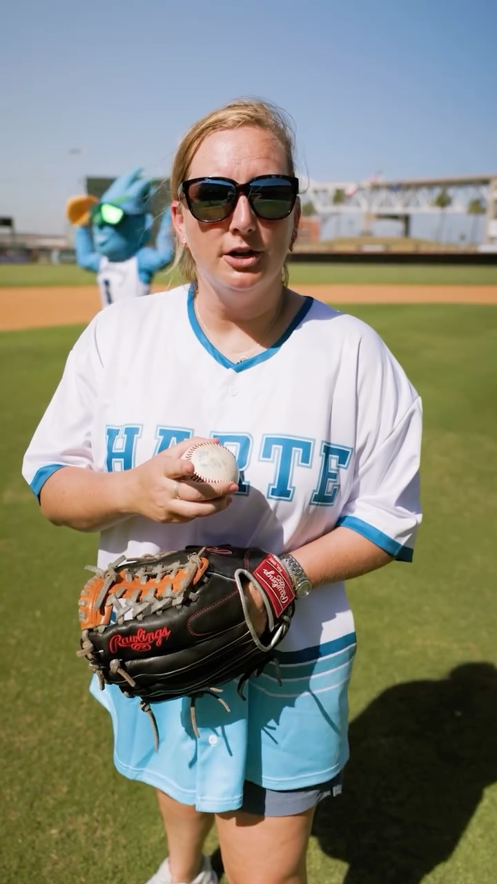 Instagram post by @island_university for Whataburger. Caption reads: Kesley’s on the mound. Izzy’s behind the....