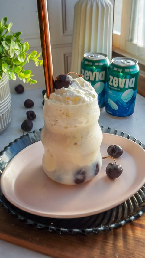 Instagram post by @purelyliving.bymaria for Zevia. Caption reads: Cherry cola float, upgraded 🍒✨ Made with @Zevia....