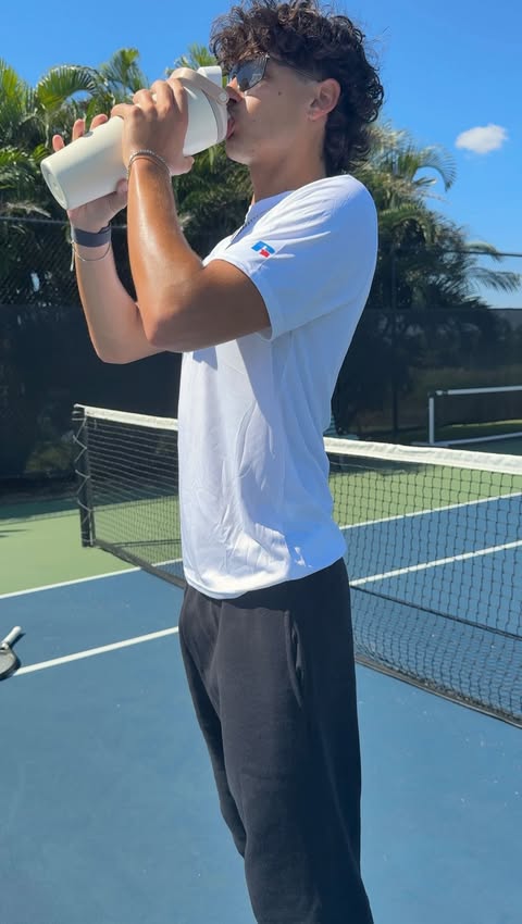 Instagram post by @cartboy_ for Russell Athletic. Caption reads: my serve or yours? 🎾 @russellathletic #RAallday....