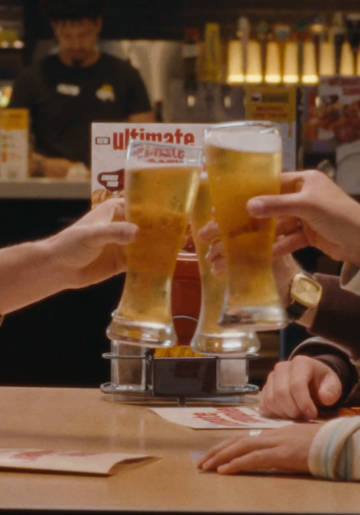 TikTok post by @jonasbrothers for Buffalo Wild Wings. Caption reads: Deep conversations at the Buffalo Wild Wings. ....