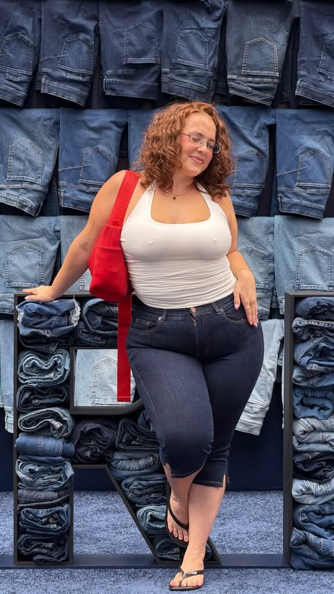 Instagram post by @thankulexx for Torrid. Caption reads: a @torrid bombshell in times square !!! [...].