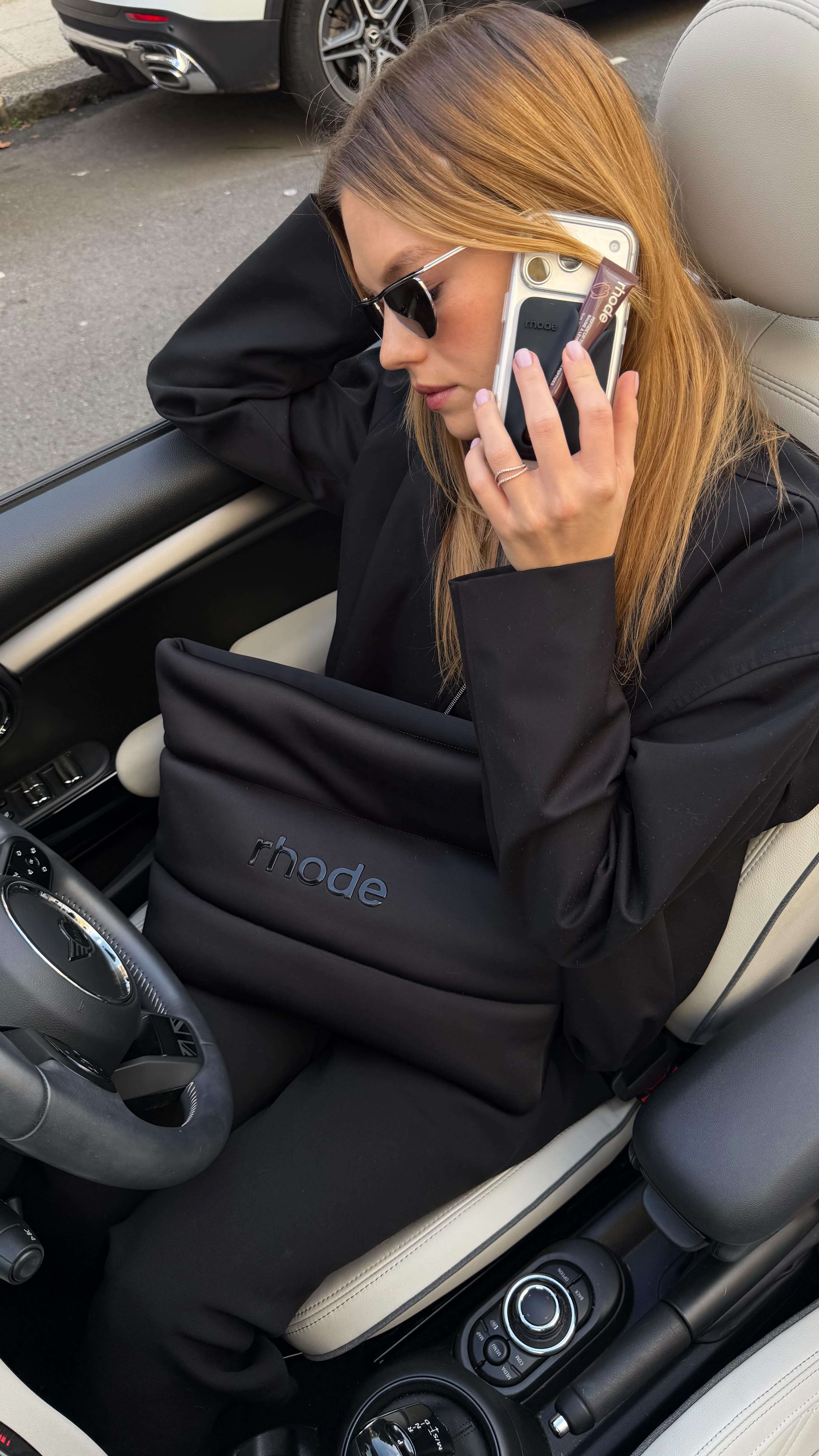 Instagram post by @nadineleopold for Rhode Skin. Caption reads: On the go 🚙.
