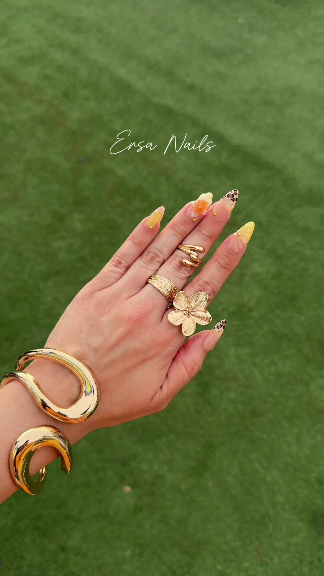 TikTok post by @rubysittaaa_xo for Ersa Nails. Caption reads: The perfect summer set 🏝️🧡🐚✨ @Ersa Nails....