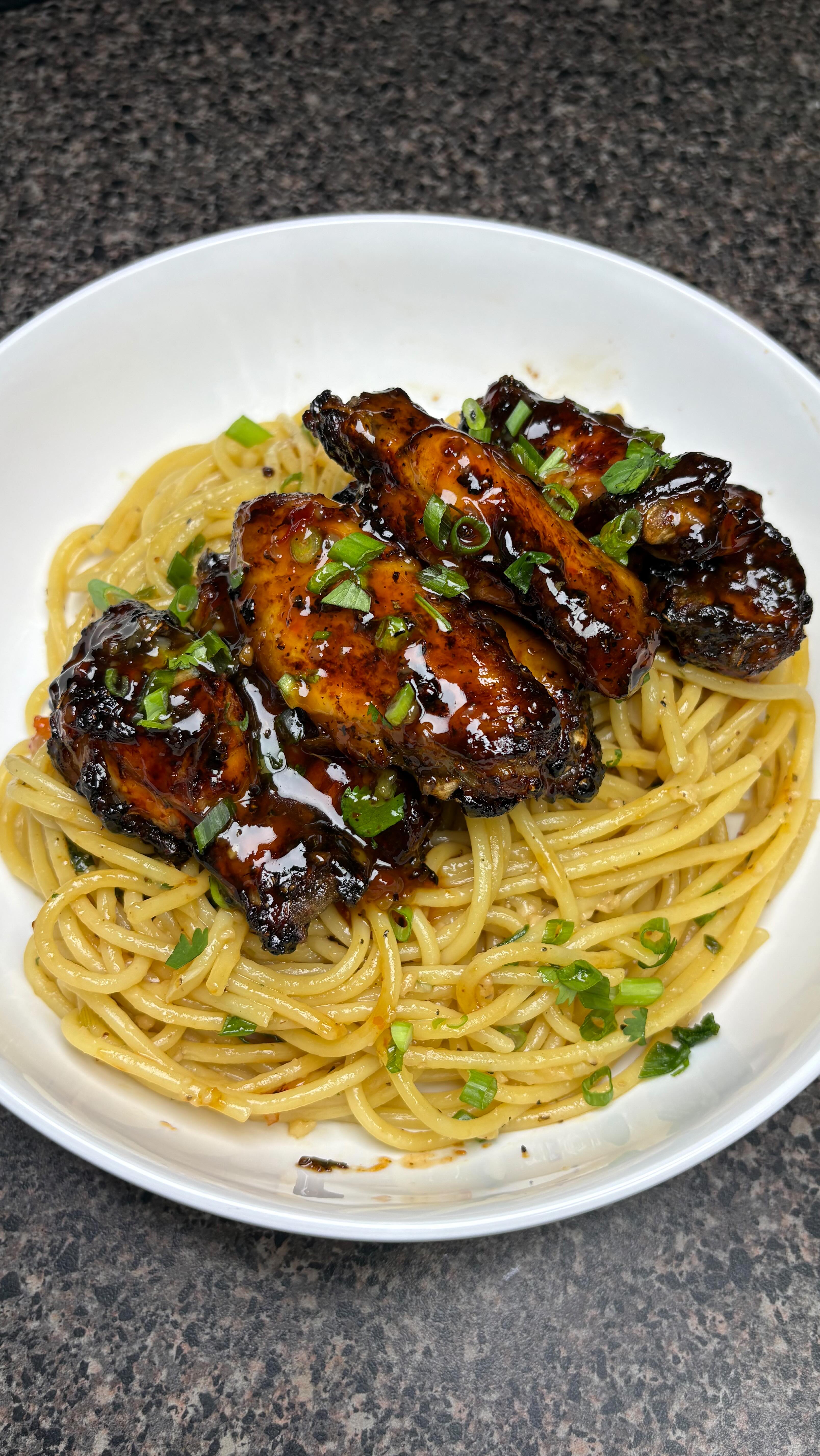 Instagram post by @daeatzwitbri for Better Than Bouillon. Caption reads: Sweet Chili Wings with Garlic Noodles....